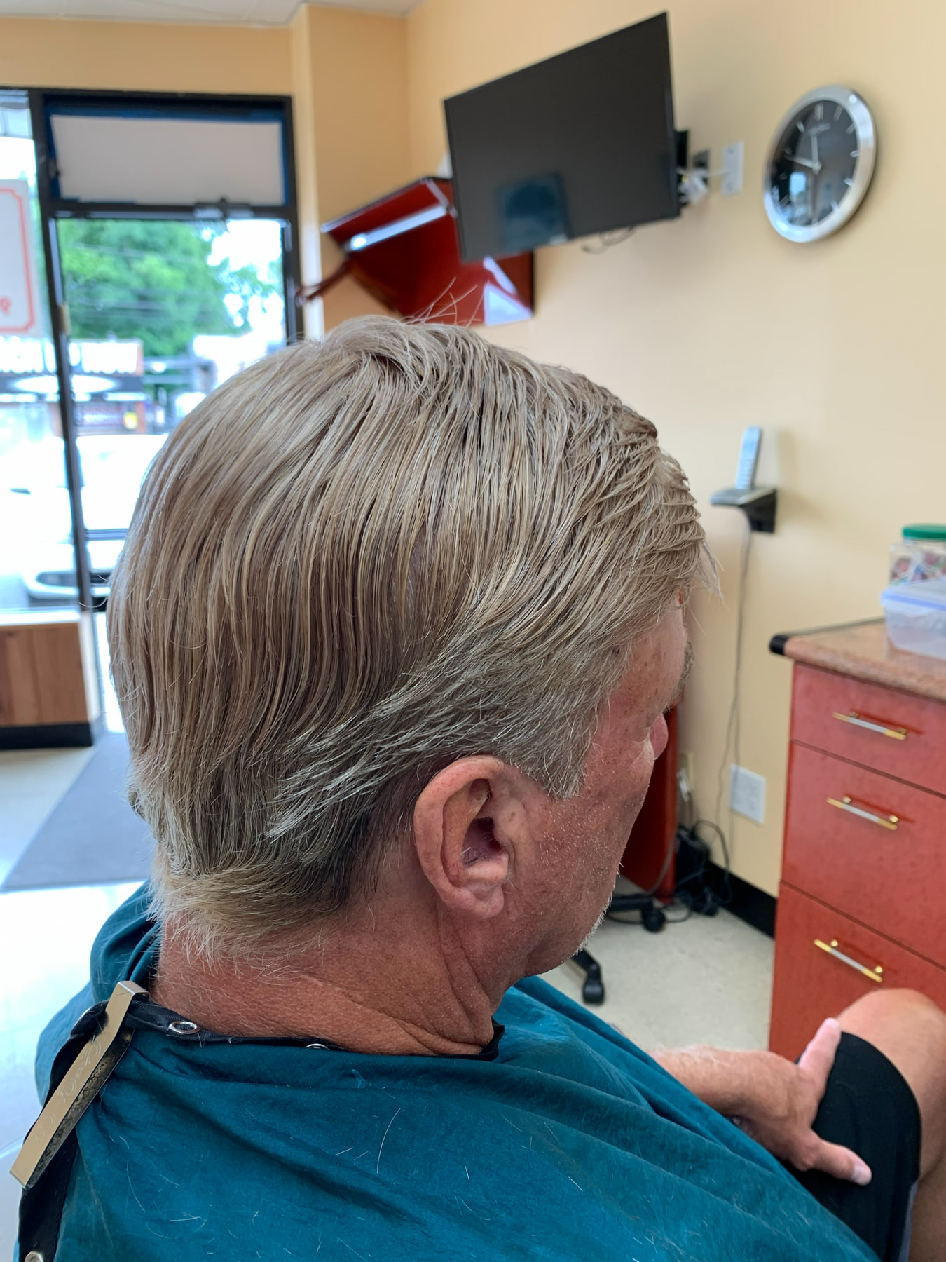 The same older UMH client with his finished gray non-surgical hair system